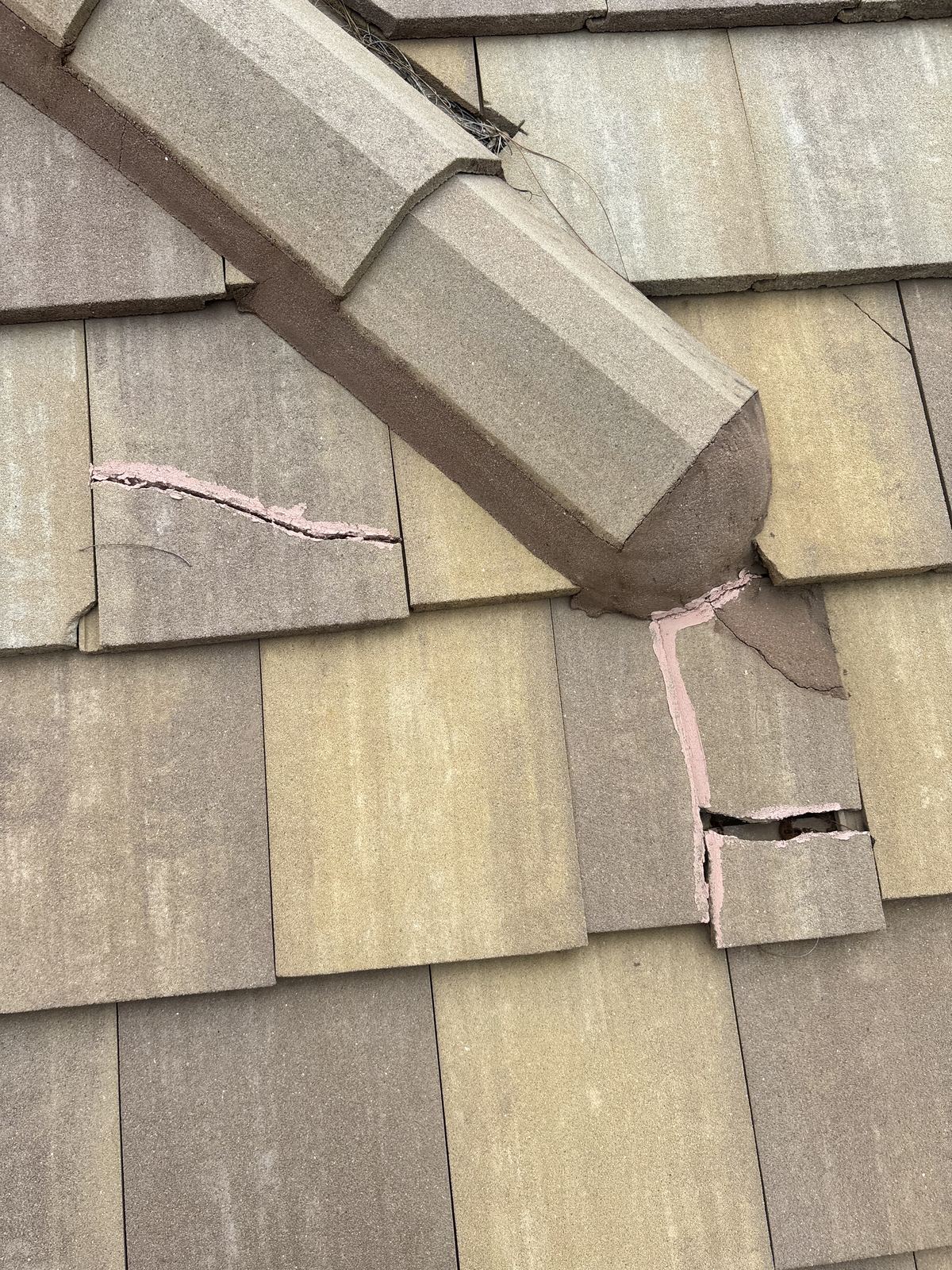Broken tiles glued back together, both repairs failed